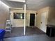 A covered back porch with brick flooring and a neutral wall, complete with a back door and window at 416 Howard Ave # D, Lakeland, FL 33815