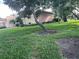 Exterior shot of the property with a view of the backyard and trees at 416 Howard Ave # D, Lakeland, FL 33815