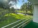 Balcony view of lush landscaping including a creek and golf course at 416 Howard Ave # D, Lakeland, FL 33815