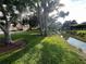 Exterior shot of the property with a view of the water and backyard at 416 Howard Ave # D, Lakeland, FL 33815