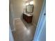 Bathroom featuring a double vanity with granite countertops, modern fixtures and decorative mirror at 416 Howard Ave # D, Lakeland, FL 33815