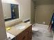 Bathroom featuring a single sink vanity with a shower and tub at 416 Howard Ave # D, Lakeland, FL 33815