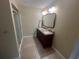 Bathroom featuring a double sink vanity with a stand up shower at 416 Howard Ave # D, Lakeland, FL 33815