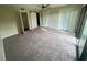 Spacious bedroom featuring ceiling fan, plush carpeting, neutral color palette and balcony access at 416 Howard Ave # D, Lakeland, FL 33815