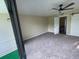 Bedroom showing ceiling fan, plush carpeting and access to large, private balcony at 416 Howard Ave # D, Lakeland, FL 33815