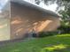 Exterior side of a building with some machinery on the green lawn at 416 Howard Ave # D, Lakeland, FL 33815