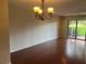Bright dining room with large sliding glass doors that lead to a patio with outdoor space and green views at 416 Howard Ave # D, Lakeland, FL 33815