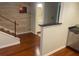 Inviting entryway with hardwood floors, connecting to a modern kitchen and staircase with natural light at 416 Howard Ave # D, Lakeland, FL 33815