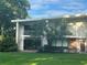 Inviting two-story condo featuring a well-manicured lawn and balcony, perfect for relaxation at 416 Howard Ave # D, Lakeland, FL 33815