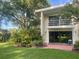 Exterior of the home with a balcony, patio, and green lawn at 416 Howard Ave # D, Lakeland, FL 33815