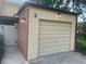 A view of the home's attached garage with updated lighting at 416 Howard Ave # D, Lakeland, FL 33815