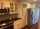 A well-equipped kitchen featuring stainless steel appliances, granite countertops, and ample cabinet space at 416 Howard Ave # D, Lakeland, FL 33815