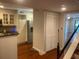 Bright kitchen with white cabinetry, stainless steel appliances, and hardwood floors, offering ample storage at 416 Howard Ave # D, Lakeland, FL 33815