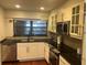 Modern kitchen with sleek stainless steel appliances, granite countertops, and lots of natural light at 416 Howard Ave # D, Lakeland, FL 33815