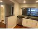 The kitchen boasts granite countertops, stainless steel appliances, and modern fixtures at 416 Howard Ave # D, Lakeland, FL 33815