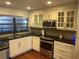 Modern kitchen with sleek stainless steel appliances, granite countertops, and lots of natural light at 416 Howard Ave # D, Lakeland, FL 33815