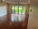 Bright living room with large sliding glass doors that lead to a patio with outdoor space and green views at 416 Howard Ave # D, Lakeland, FL 33815