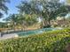 The community pool is set amidst mature trees and lush landscaping at 416 Howard Ave # D, Lakeland, FL 33815