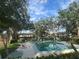 Inviting community pool surrounded by lush landscaping and lounge chairs for residents' relaxation and enjoyment at 416 Howard Ave # D, Lakeland, FL 33815