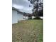 Spacious backyard with green grass and a wooden playset for outdoor enjoyment at 426 Cardinal Ct, Kissimmee, FL 34759