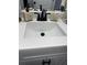 Close up of a bathroom sink with a white countertop and modern fixtures at 426 Cardinal Ct, Kissimmee, FL 34759