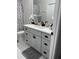 Bathroom features modern vanity with quartz counters, sink, and large mirror at 426 Cardinal Ct, Kissimmee, FL 34759