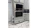 Modern kitchen featuring built in stainless microwave and oven with ample cabinet and storage space at 426 Cardinal Ct, Kissimmee, FL 34759