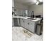 Bright kitchen boasts island sink, stainless dishwasher, and access to outdoor patio through sliding glass doors at 426 Cardinal Ct, Kissimmee, FL 34759