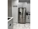 Modern kitchen featuring stainless steel appliances, ample cabinets, and quartz countertop at 426 Cardinal Ct, Kissimmee, FL 34759