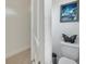 Elegant bathroom features artistic decor and a modern toilet at 4899 Meadow Dr, St Cloud, FL 34772