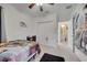 Cozy bedroom with carpet, closet, desk, and dark rug, featuring a dinosaur theme at 4899 Meadow Dr, St Cloud, FL 34772