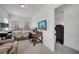 Comfortable bedroom includes a reading nook with a chair and work space with a television at 4899 Meadow Dr, St Cloud, FL 34772