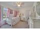Charming bedroom with white furniture, princess theme, and bright natural light at 4899 Meadow Dr, St Cloud, FL 34772