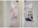 View of two bedrooms with different decor, accessible from the hallway at 4899 Meadow Dr, St Cloud, FL 34772