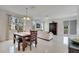 View of dining room featuring sleek tile floors and large windows at 4899 Meadow Dr, St Cloud, FL 34772