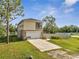 Lovely two-story home with a garage, a fenced yard, and a well-maintained lawn, perfect for outdoor enjoyment at 4899 Meadow Dr, St Cloud, FL 34772