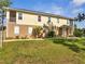 Two-story house with well-maintained lawn, exterior shutters and nice landscaping at 4899 Meadow Dr, St Cloud, FL 34772