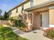 Charming front entrance with landscaped walkway, potted plants, and manicured lawn at 4899 Meadow Dr, St Cloud, FL 34772