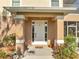 Close up view of the front porch showing door and plants at 4899 Meadow Dr, St Cloud, FL 34772