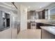 Well-equipped kitchen with stainless steel appliances and dark cabinets at 4899 Meadow Dr, St Cloud, FL 34772