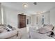 Beautiful living room with large windows, tile floors, and stylish furnishings at 4899 Meadow Dr, St Cloud, FL 34772