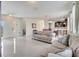 Beautiful living room with large windows, tile floors, and stylish furnishings at 4899 Meadow Dr, St Cloud, FL 34772