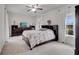 Inviting primary bedroom with large windows, ceiling fan, and elegant furniture at 4899 Meadow Dr, St Cloud, FL 34772