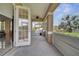 Enjoy the breeze on this screened patio with a ceiling fan and views of the backyard at 4899 Meadow Dr, St Cloud, FL 34772