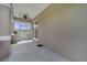 This screened patio features a ceiling fan and plenty of space for outdoor enjoyment at 4899 Meadow Dr, St Cloud, FL 34772