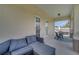 Covered outdoor patio, featuring comfortable seating and a serene natural view at 4899 Meadow Dr, St Cloud, FL 34772