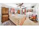 Cozy bedroom with a ceiling fan, warm lighting, and comfortable furnishings for a relaxing retreat at 517 Carolina Ave, St Cloud, FL 34769