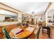 Cozy dining room with a wooden table, green chairs, and natural light, creating a warm gathering space at 517 Carolina Ave, St Cloud, FL 34769