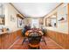 Charming dining area features wood-paneled walls, a cozy table setting, and bright accents for a welcoming atmosphere at 517 Carolina Ave, St Cloud, FL 34769