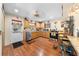 Well-equipped kitchen with wood cabinets, a stainless steel dishwasher, and a convenient layout for meal preparation at 517 Carolina Ave, St Cloud, FL 34769
